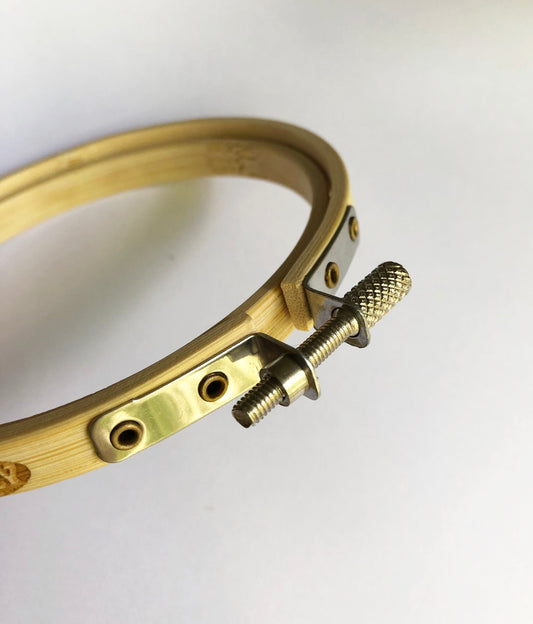 A 10cm wood embroidery hoop is a small, circular frame made of two concentric wooden rings. The outer ring usually has a metal screw that can be tightened to secure fabric between the rings. The 10cm (4-inch) diameter makes it ideal for small-scale embroidery or mending work.
When used for darning, the hoop holds fabric taut, making it easier to repair holes or worn areas—especially in sweaters, or woven garments. It keeps the fabric stretched evenly.projects