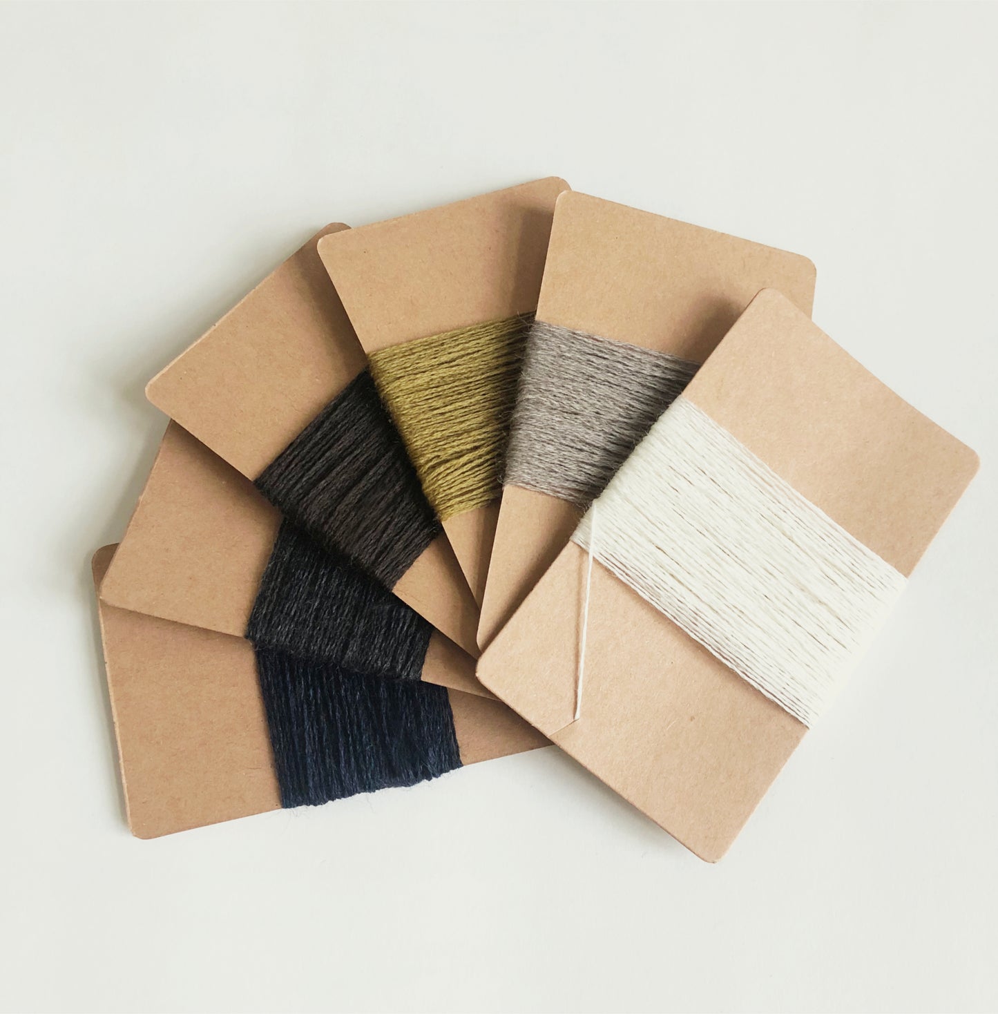 A set of 6 mono colour 100% wool darning yarns for a set of essential darning tools. Repair holes in socks or mend moth holes in jumpers with toolly's plastic free darning kit.