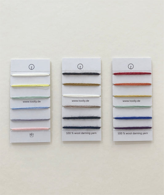 100% Wool Darning Yarn Colour Cards showing pastel, neutral, and vibrant shades for mending, embroidery, and decorative stitching.