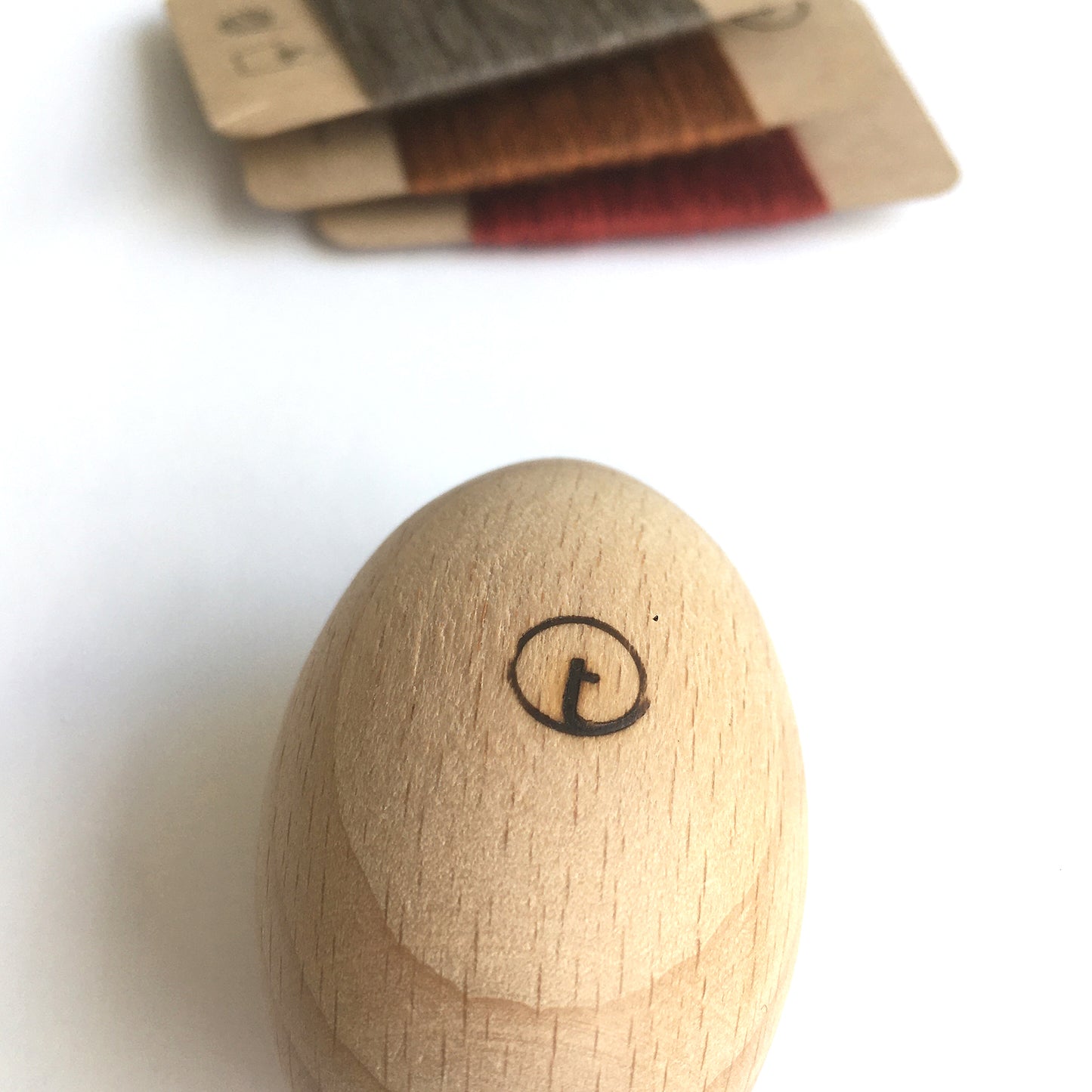 A wooden darning egg is a traditional sewing tool used for mending holes or worn areas in socks, sweaters, and other knitwear. Shaped like a mushroom with a smooth, rounded top and a comfortable handle, it provides a firm surface to stretch fabric over, making it easier to stitch evenly. Made from durable wood, it's a sustainable and reusable tool perfect for visible mending or extending the life of your favourite garments.