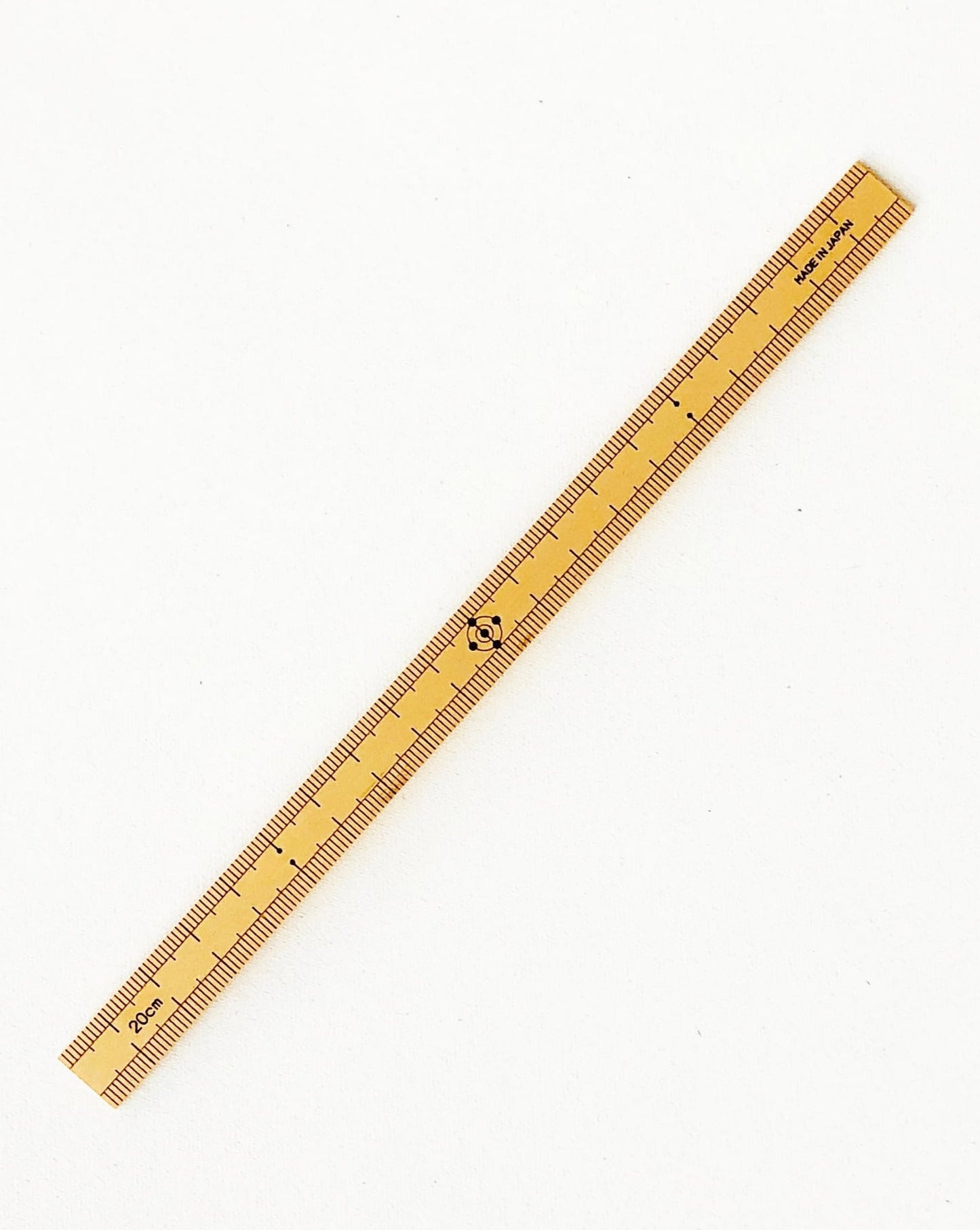 20cm bamboo sewing scale with engraved markings, made in Japan from 100% Japanese bamboo; compact, lightweight, and ideal for precise measurements near a sewing machine.