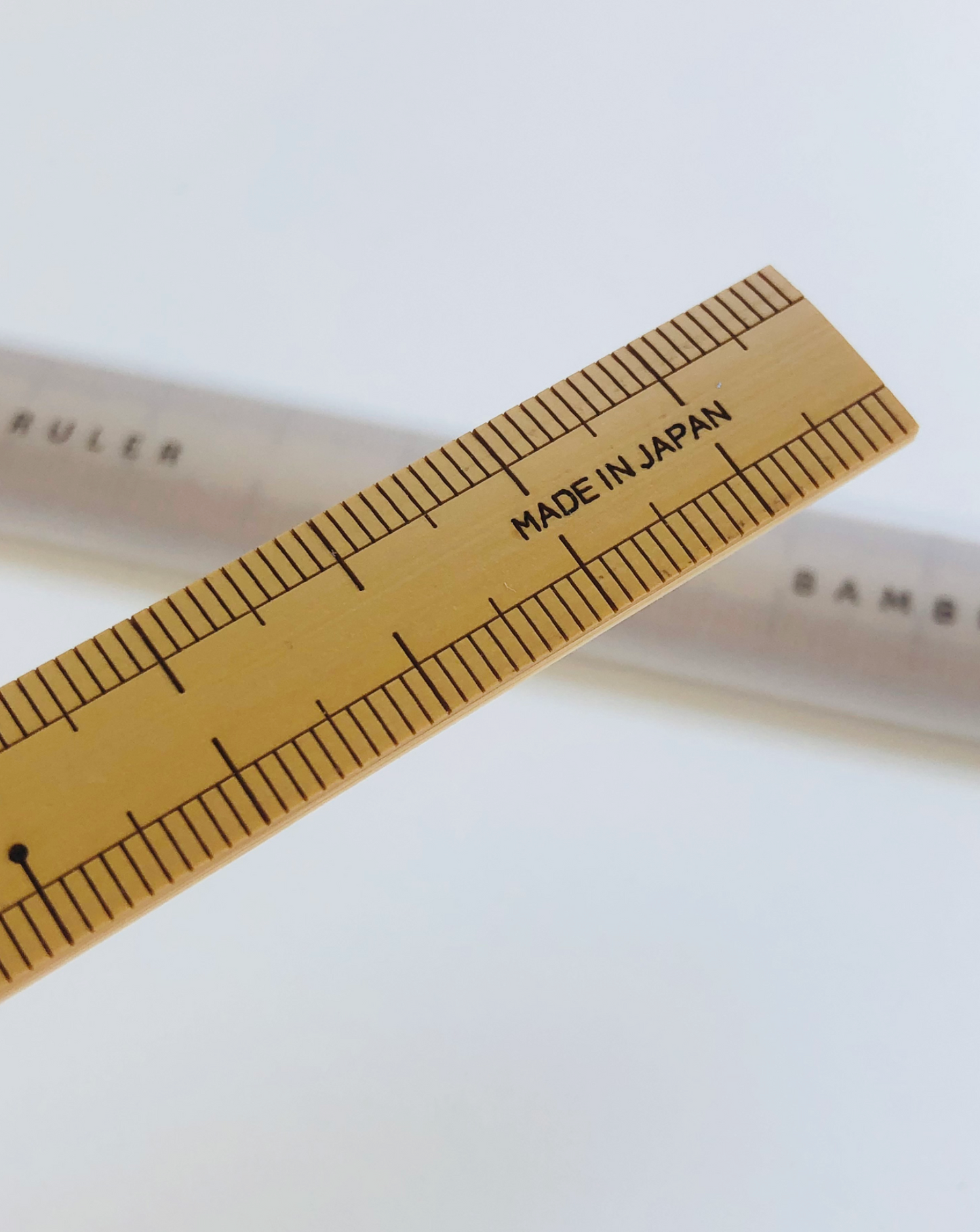20cm Japanese bamboo sewing scale with engraved markings; compact, lightweight (5g), plastic-free, ideal for precise measuring near a sewing machine."