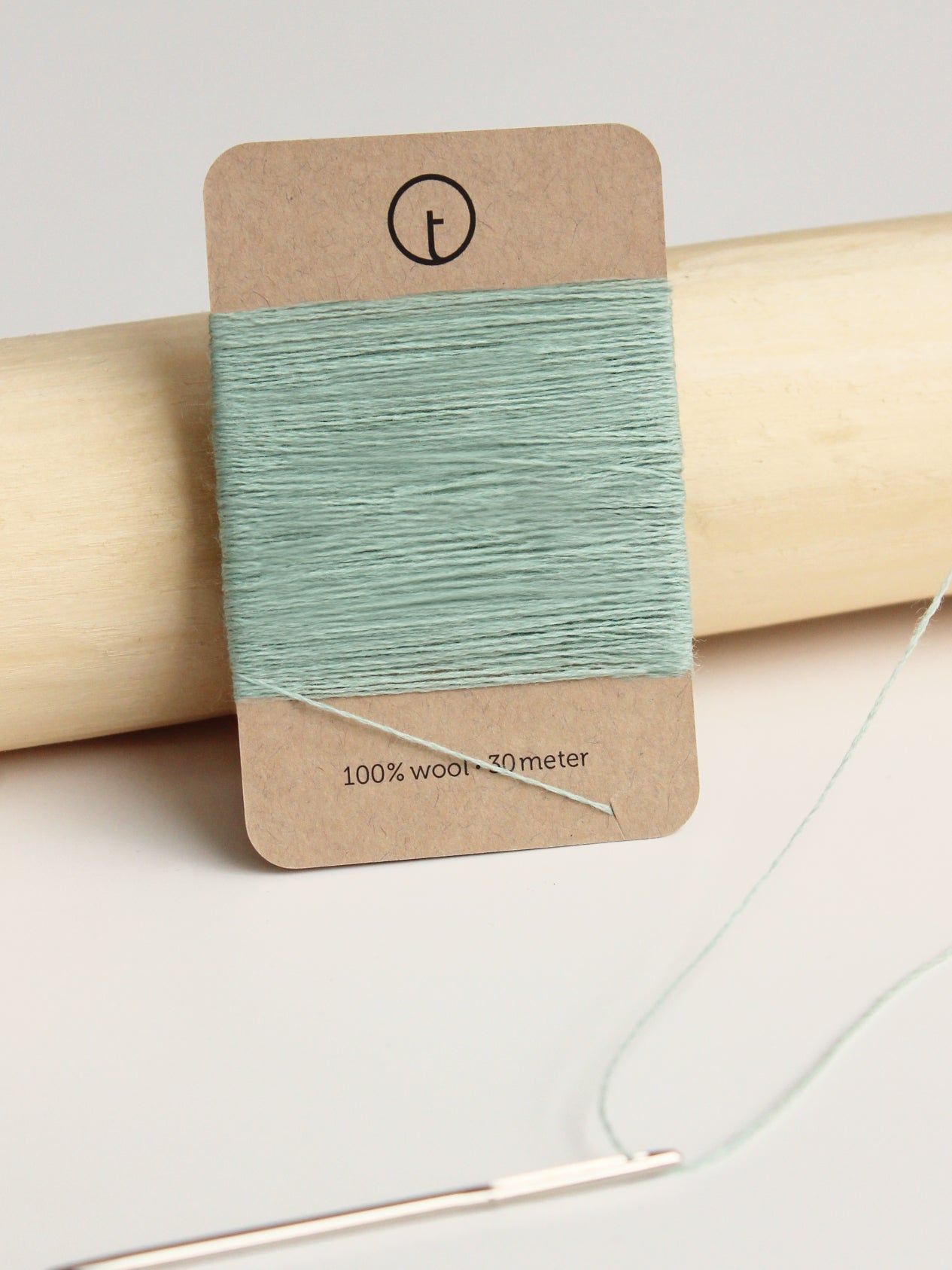 A 30-meter card of 100% wool darning yarn in mint colour neatly wrapped around a labeled rectangular paper card, ideal for repairing knitwear.
toolly offers darning yarns in 9 essential colors. They are 100% pure wool without any artificial fiber. 30 meter yarn is wound around kraft paper card. Set of 3 colors, 7 colors and a color sample card can be also purchased.