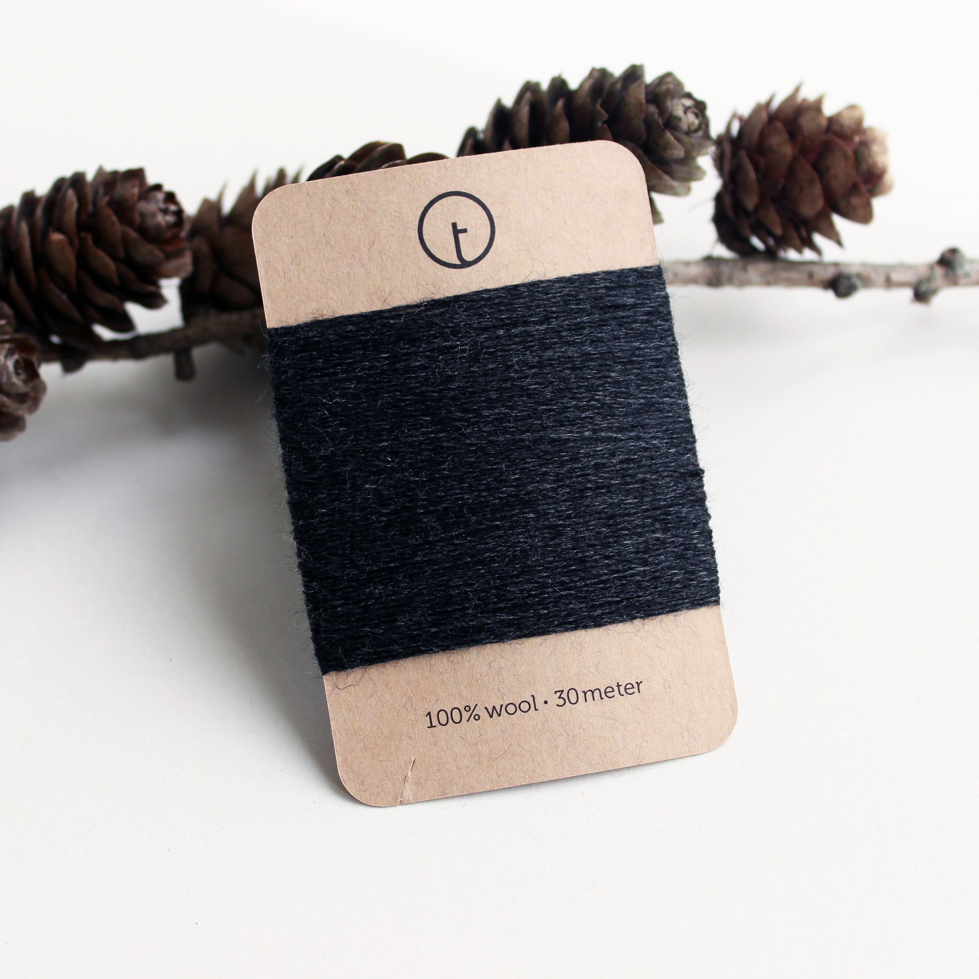 A 30-meter card of 100% wool darning yarn in charcoal (dark grey) colour, neatly wound and ready for mending knit garments. The yarn is packaged in a small, eco-friendly parchment paper bag.
toolly offers darning yarns in 9 essential colours. They are 100% pure wool without any artificial fiber. 30 meter yarn is wound around kraft paper card. Set of 3 colours, 6 colours and a color sample card can be also purchased.