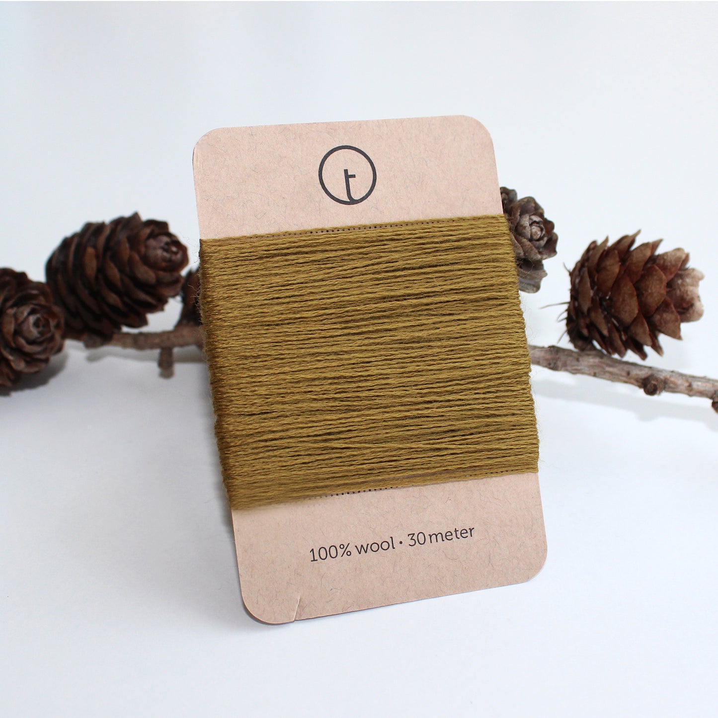 A 30-meter card of 100% wool darning yarn in mustard (light brown) colour, neatly wound and ready for mending knit garments. The yarn is packaged in a small, eco-friendly parchment paper bag.
toolly offers darning yarns in 9 essential colours. They are 100% pure wool without any artificial fiber. 30 meter yarn is wound around kraft paper card. Set of 3 colours, 6 colours and a color sample card can be also purchased.