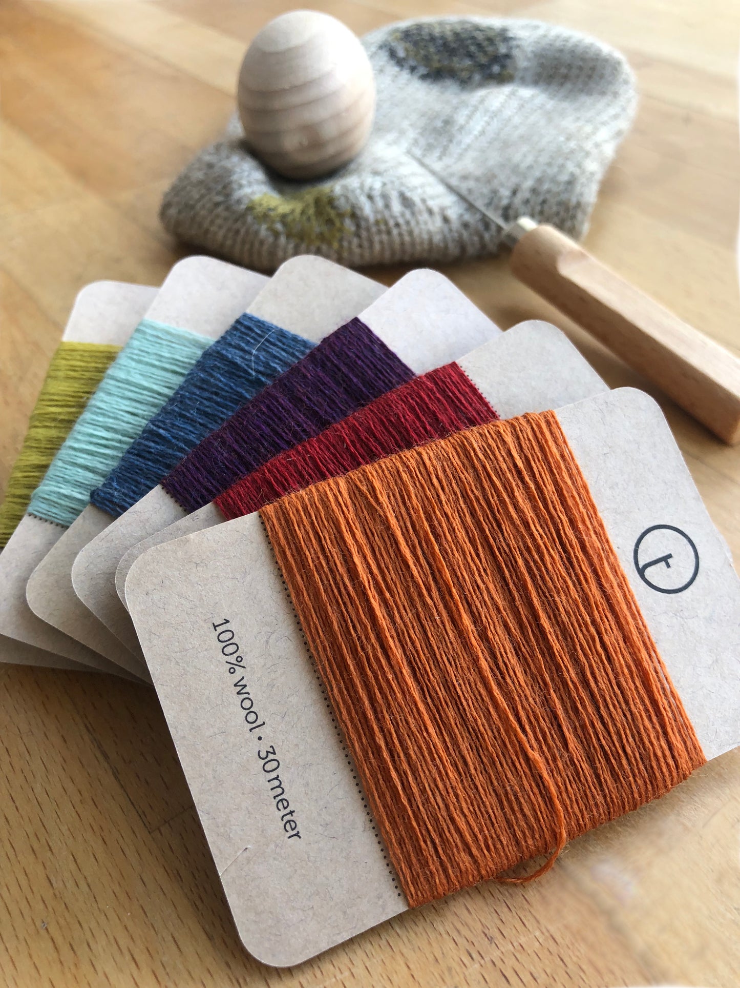 A set of six 30-meter cards of 100% wool fine darning yarn in assorted colourful colours. Ideal for mending socks, sweaters, and other wool garments.