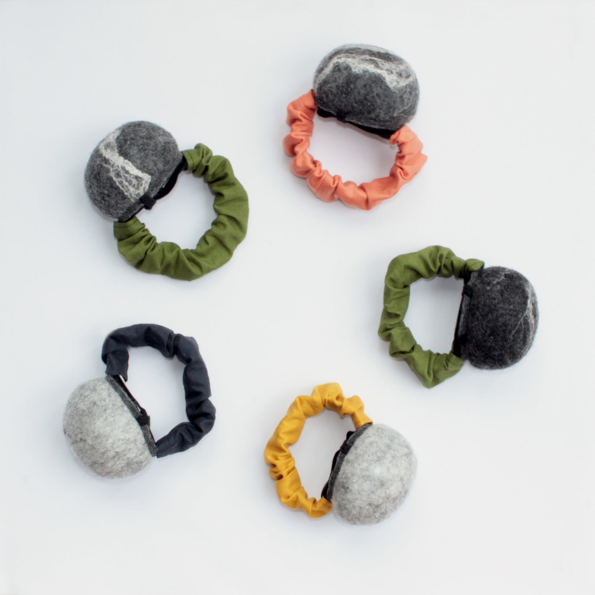 sustainable sewing - not only fabrics but also notions can be eco friendly. toolly's arm pincushions sre made of pure wool, organic cotton, organic rubber band and natural button. Available in different shades of felt and band colors.