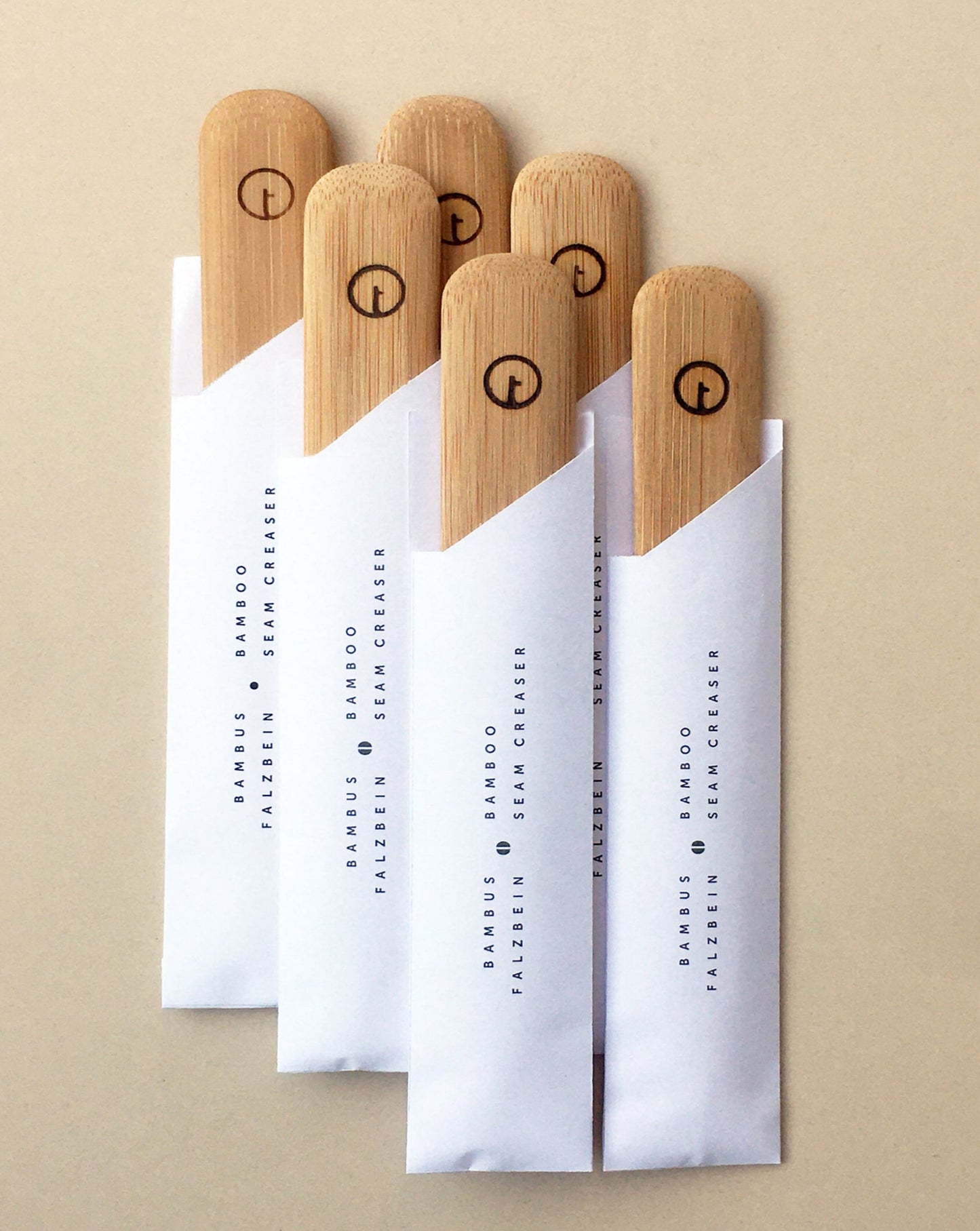A seam creaser made of bamboo is a useful tool for both paper and fabric. They come in paper packaging inspired by chopstick paper bag.
