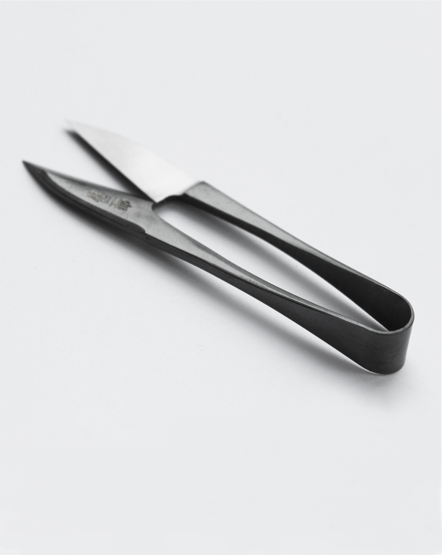 Traditional Japanese U-shaped spring scissors by Shozaburo, made of premium carbon steel; 10.5 cm long, 30 g, beautifully boxed with care guide—ideal for delicate, detailed cutting and thread trimming.