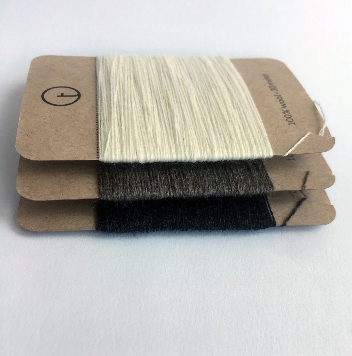 30-meter darning yarn cards made of 100% pure wool in assorted essential colours, ideal for mending socks, sweaters, and other wool garments; wound on kraft paper cards, with optional colour sample card and sets available