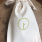 A small cotton sachet for a set of essential darning tools. Repair holes in socks or mend moth holes in jumpers with toolly's plastic free darning kit.
