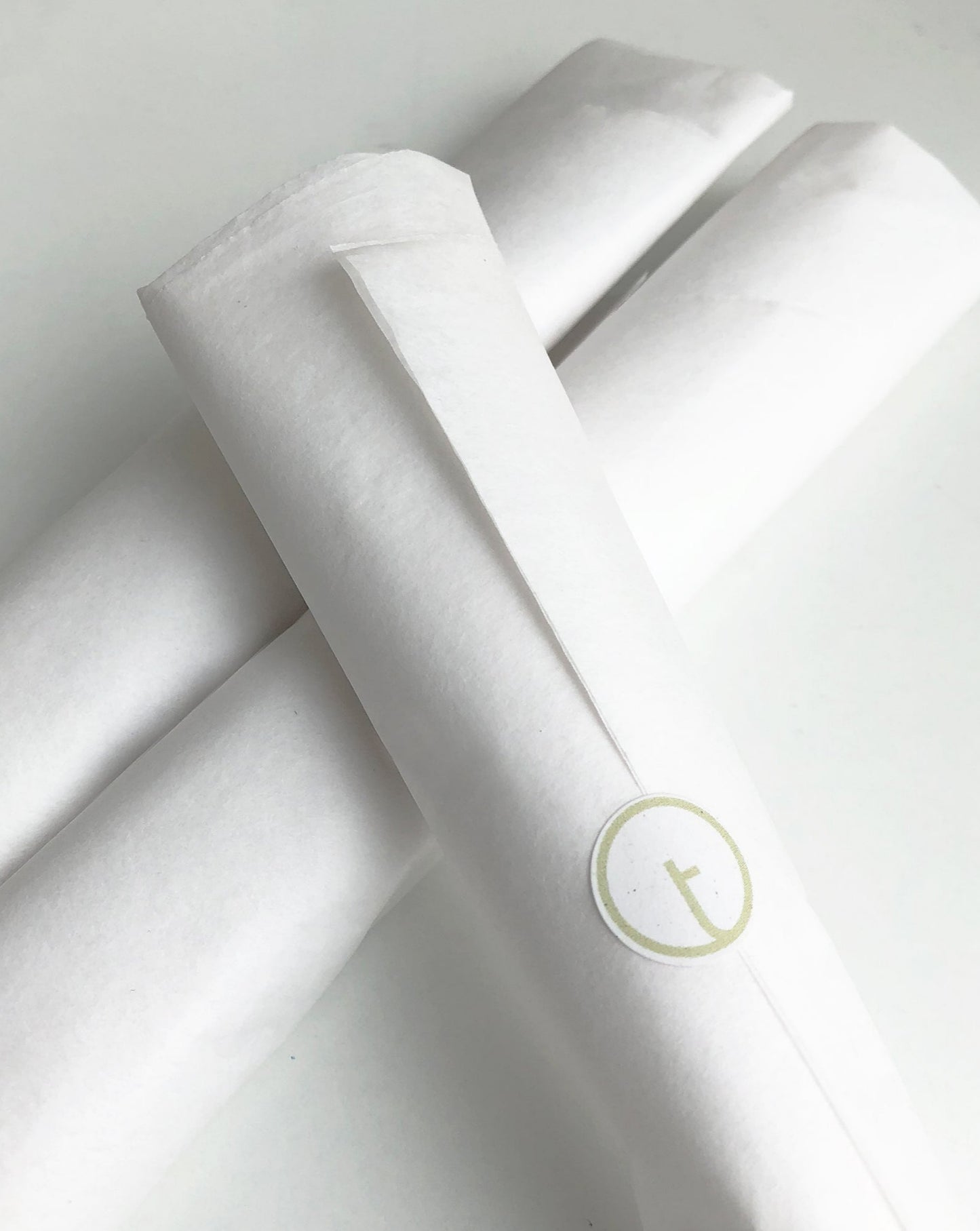 toolly's dust-off brush is wrapped in a tissue paper. Plastic-free packaging for every product.